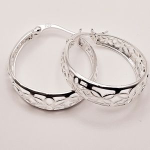 Sterling silver hoop earrings with open metal work design